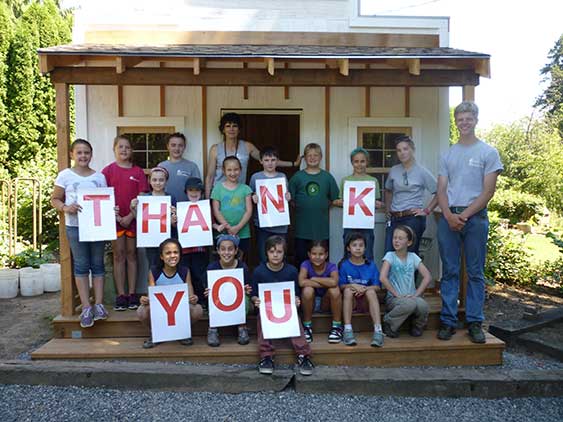 Children Spelling Thank You At OMF Inc.